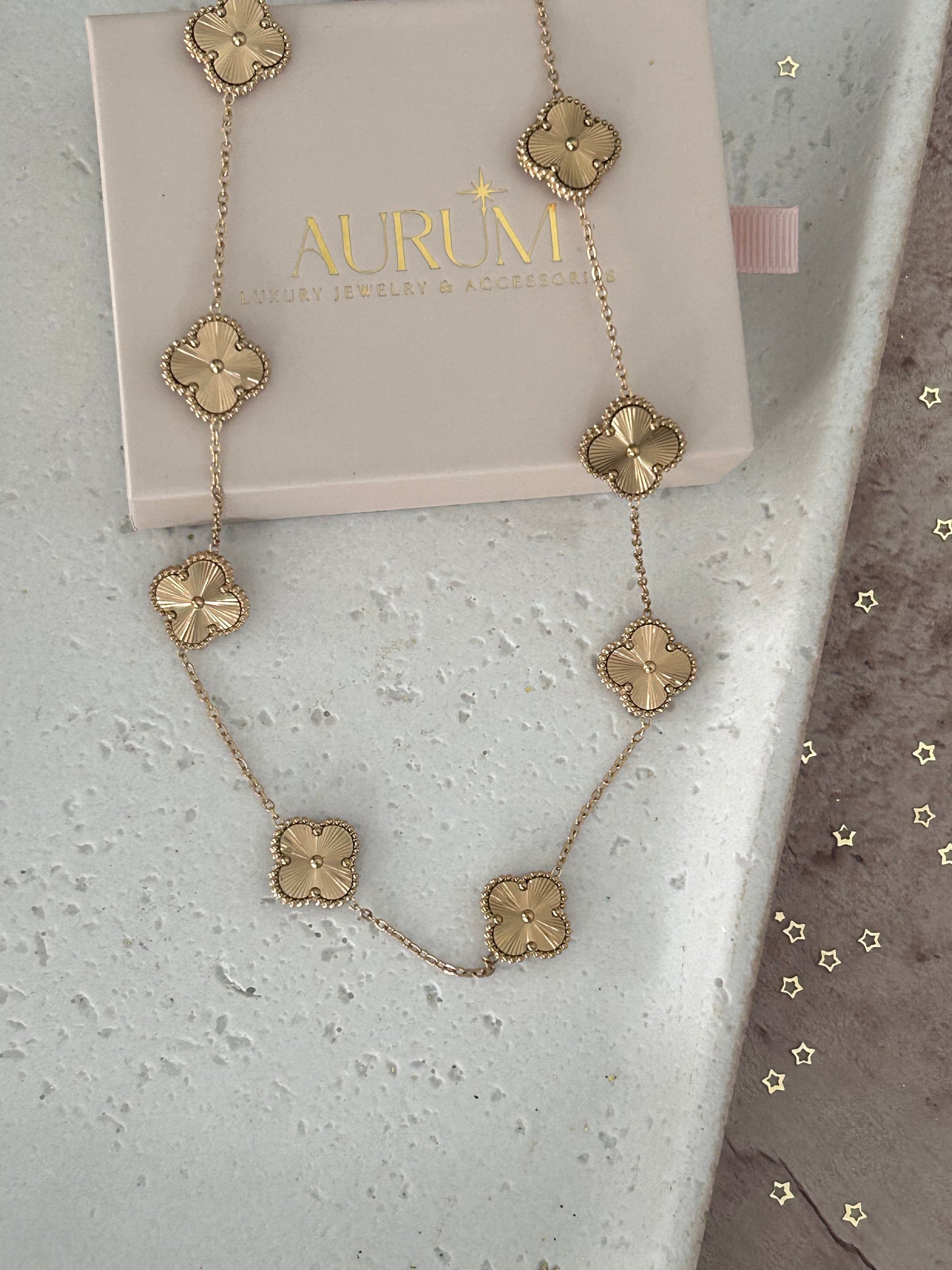 18K gold-plated All over gold Clover Necklace. waterproof, hypoallergenic, and chic.