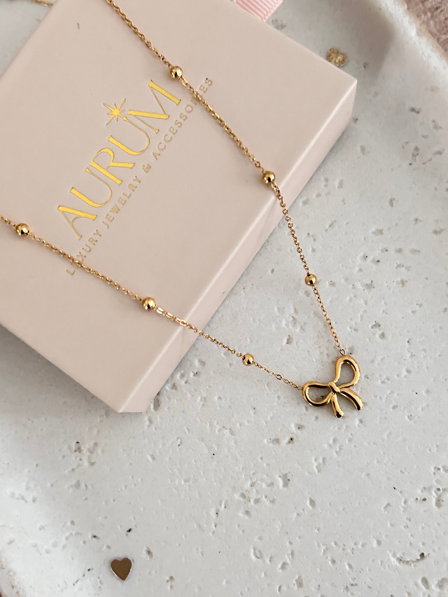 Gold bow necklace