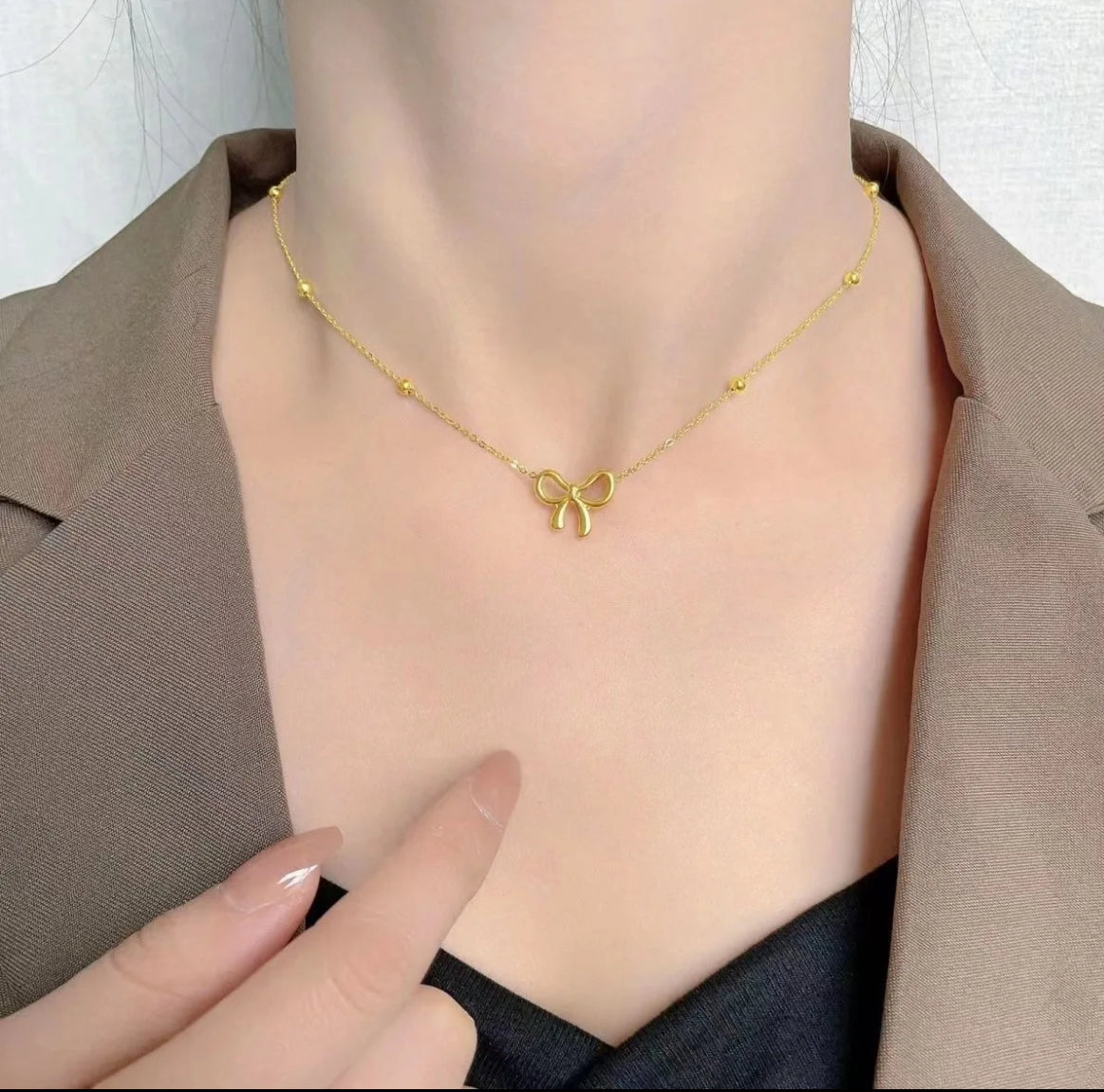 Aurum jewelry dainty gold bow necklace 